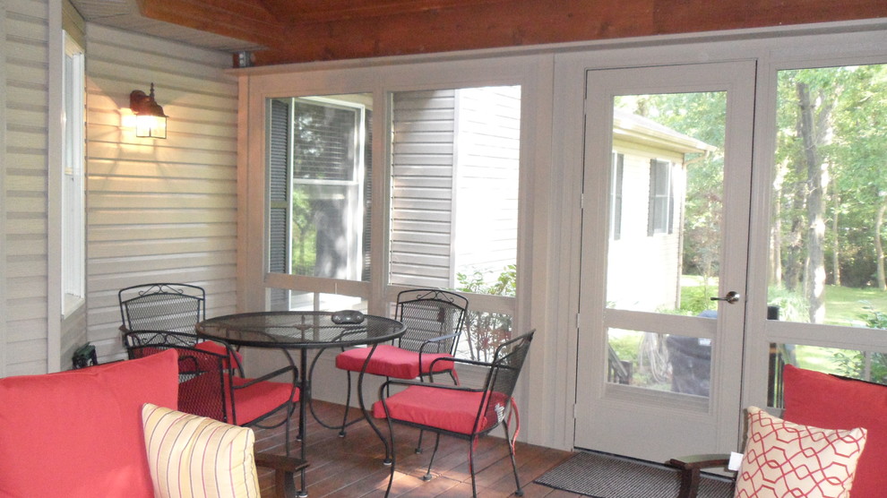 This is an example of a mid-sized country sunroom in St Louis.