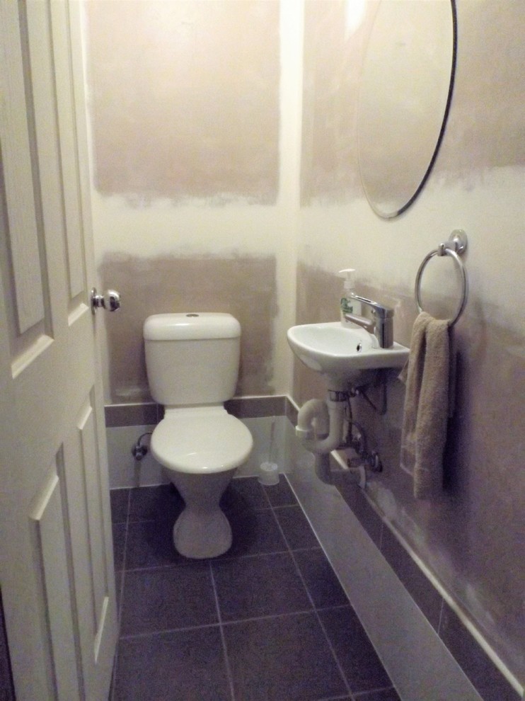 Small modern bathroom in Sydney with a two-piece toilet, ceramic tile, white walls and ceramic floors.