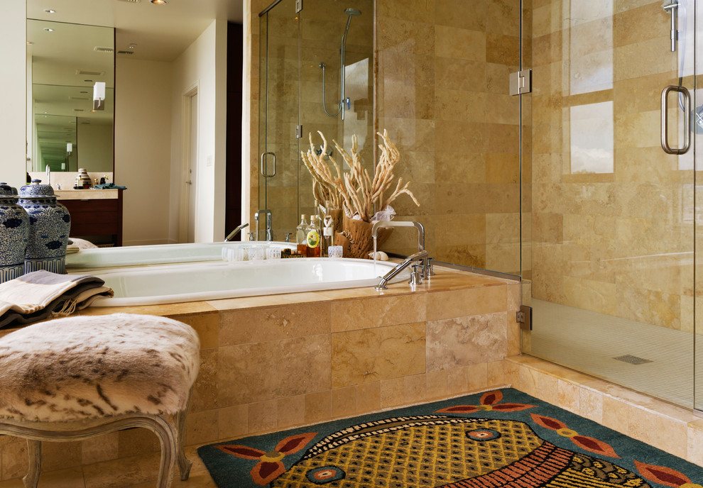 This is an example of an eclectic master bathroom in Portland with an undermount sink, flat-panel cabinets, medium wood cabinets, limestone benchtops, a drop-in tub, an alcove shower, a one-piece toilet, beige tile, stone tile, beige walls and limestone floors.