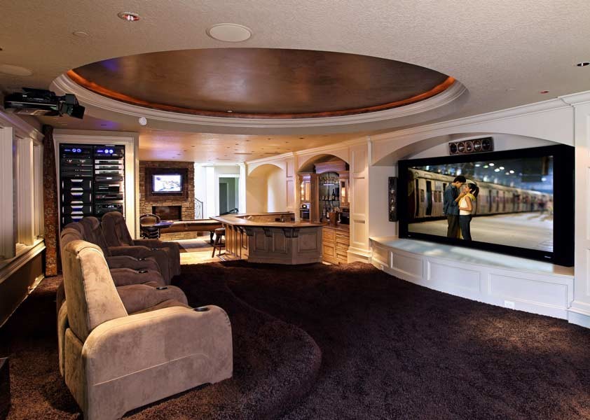 Inspiration for a large eclectic open concept home theatre in Portland with white walls, carpet and a projector screen.