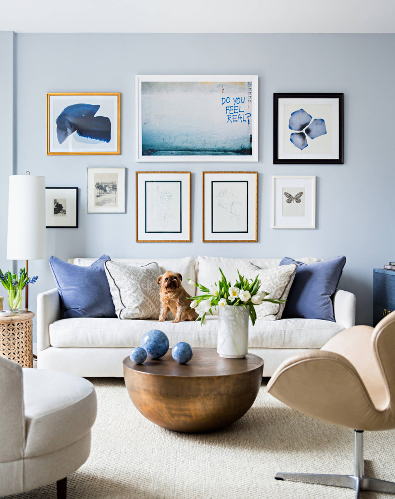 This is an example of a beach style formal living room in Orange County with blue walls.