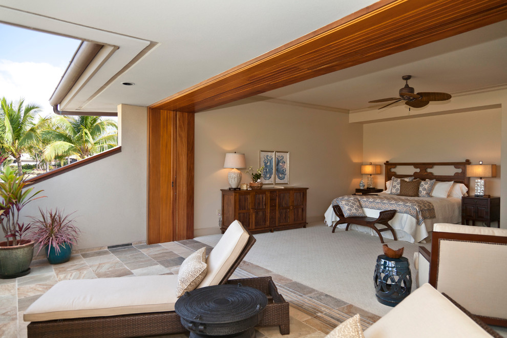 Tropical bedroom in Hawaii with beige walls and carpet.