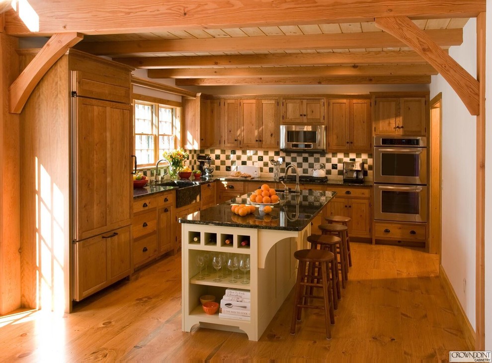 Mid-sized mountain style enclosed kitchen photo in DC Metro with recessed-panel cabinets, light wood cabinets and an island