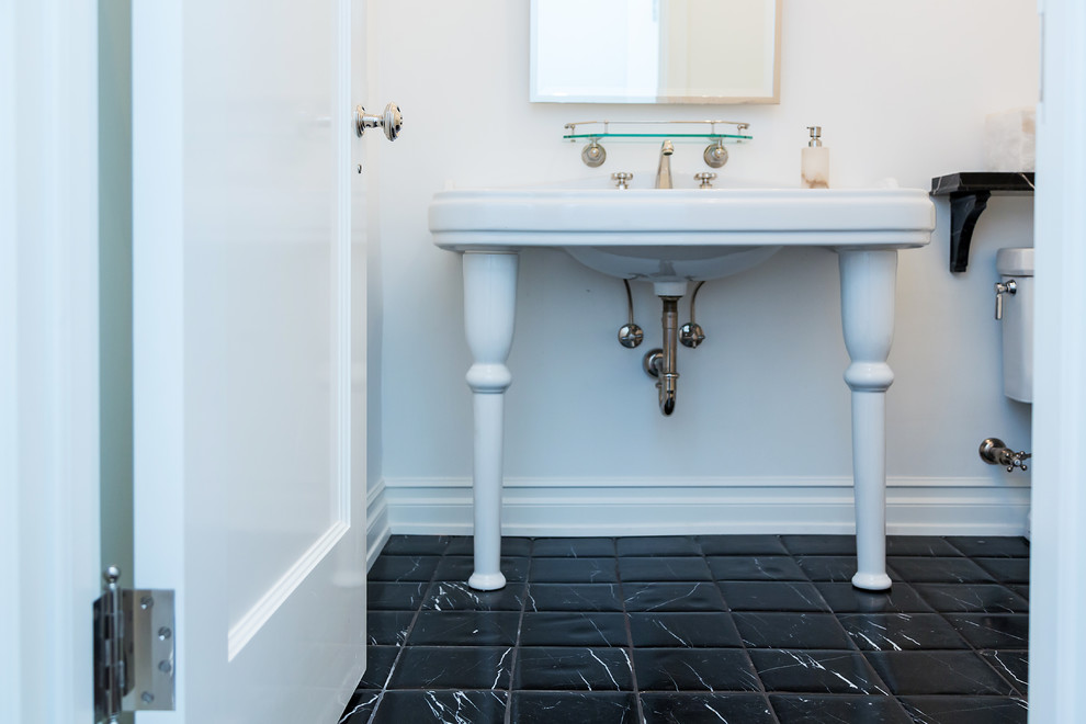 Photo of a small contemporary powder room in Los Angeles with furniture-like cabinets, white walls, marble floors, an undermount sink, engineered quartz benchtops, black floor and white benchtops.
