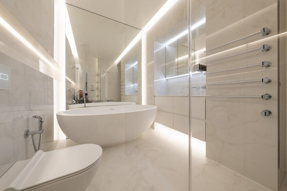 Design ideas for a large modern master bathroom in London with open cabinets, white cabinets, a drop-in tub, a shower/bathtub combo, a bidet, white tile, glass tile, white walls, ceramic floors, a drop-in sink, stainless steel benchtops, white floor, a hinged shower door, grey benchtops, a single vanity, a floating vanity, wood and decorative wall panelling.