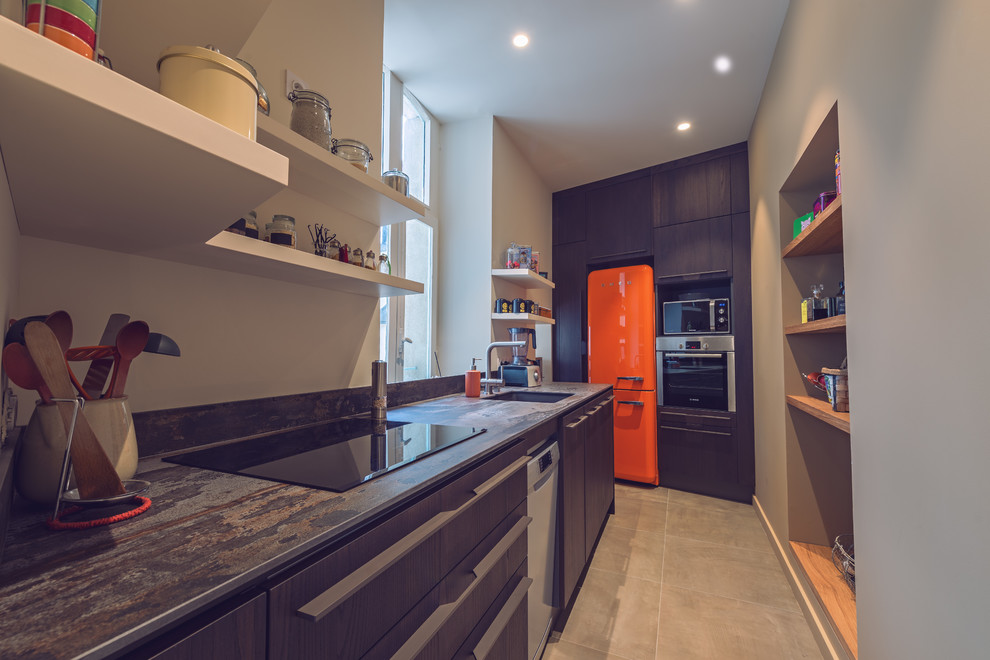 This is an example of a small contemporary single-wall open plan kitchen in Rennes with an integrated sink, beaded inset cabinets, dark wood cabinets, stainless steel appliances, ceramic floors, beige floor and brown benchtop.