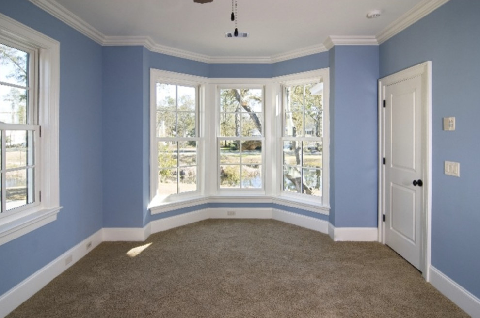Inspiration for a mid-sized traditional guest bedroom in Denver with blue walls, carpet, no fireplace and beige floor.