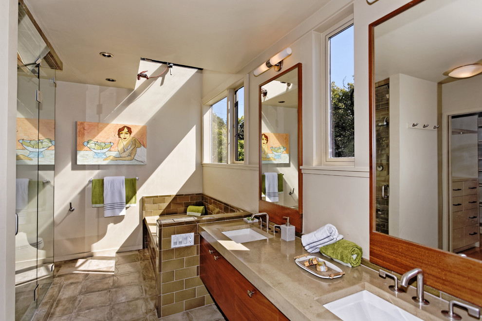 Photo of a midcentury master bathroom in San Francisco with an undermount sink, flat-panel cabinets, medium wood cabinets, a curbless shower, brown tile, subway tile and beige walls.