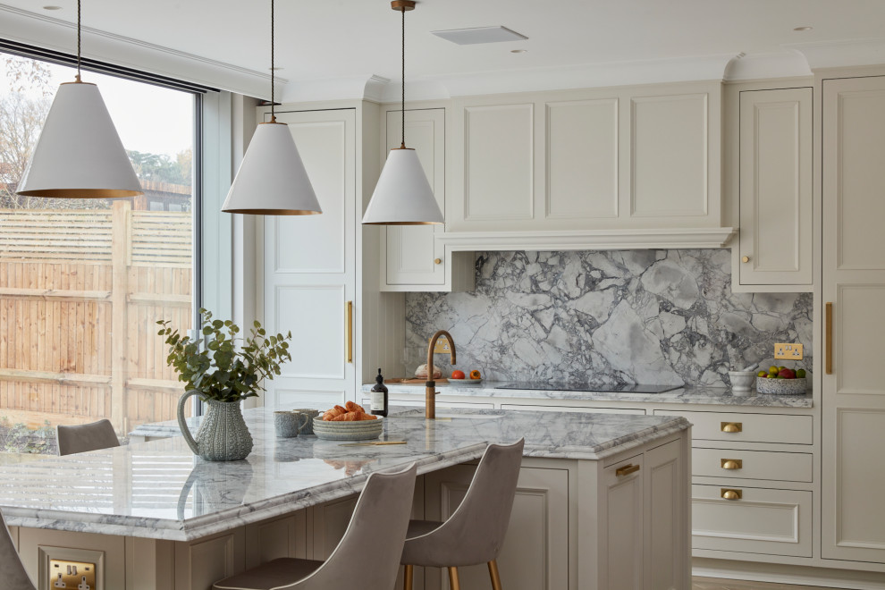 Inspiration for a mid-sized timeless l-shaped kitchen remodel in London with shaker cabinets