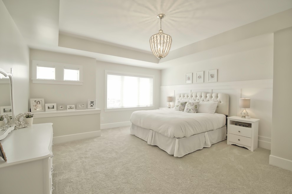 Photo of a large contemporary master bedroom in Vancouver with white walls and carpet.