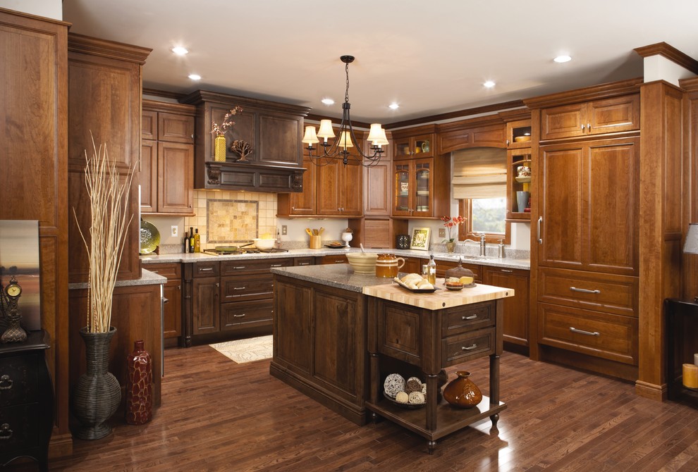 Inspiration for a large transitional u-shaped separate kitchen in Minneapolis with an undermount sink, raised-panel cabinets, medium wood cabinets, quartz benchtops, yellow splashback, ceramic splashback, panelled appliances, dark hardwood floors, with island, brown floor and grey benchtop.