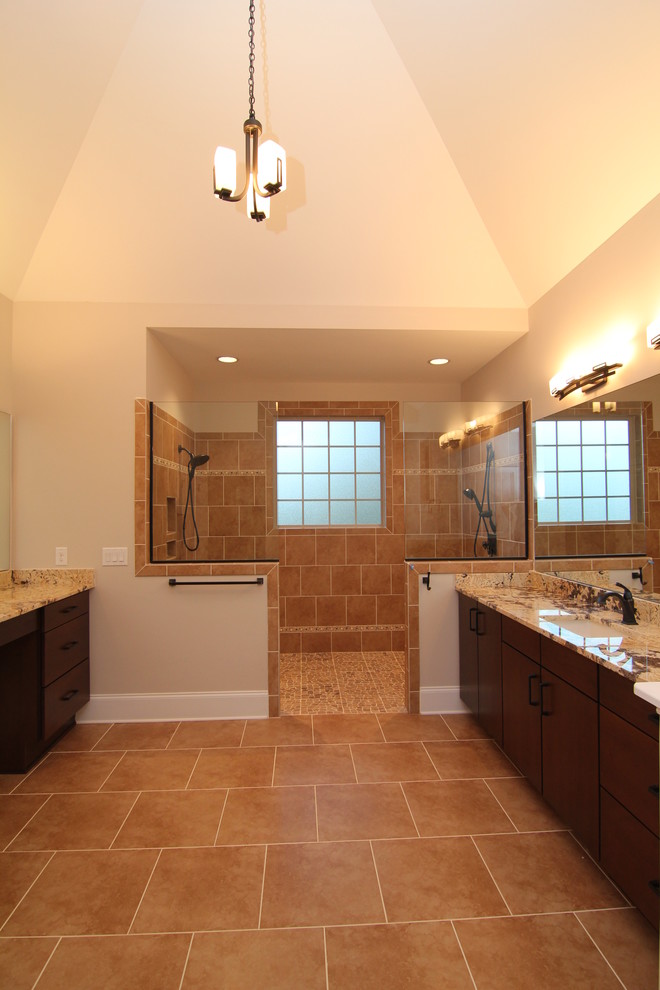 Inspiration for an expansive traditional master bathroom in Raleigh with an undermount sink, flat-panel cabinets, dark wood cabinets, granite benchtops, an open shower, a one-piece toilet, multi-coloured tile, ceramic tile, beige walls and ceramic floors.