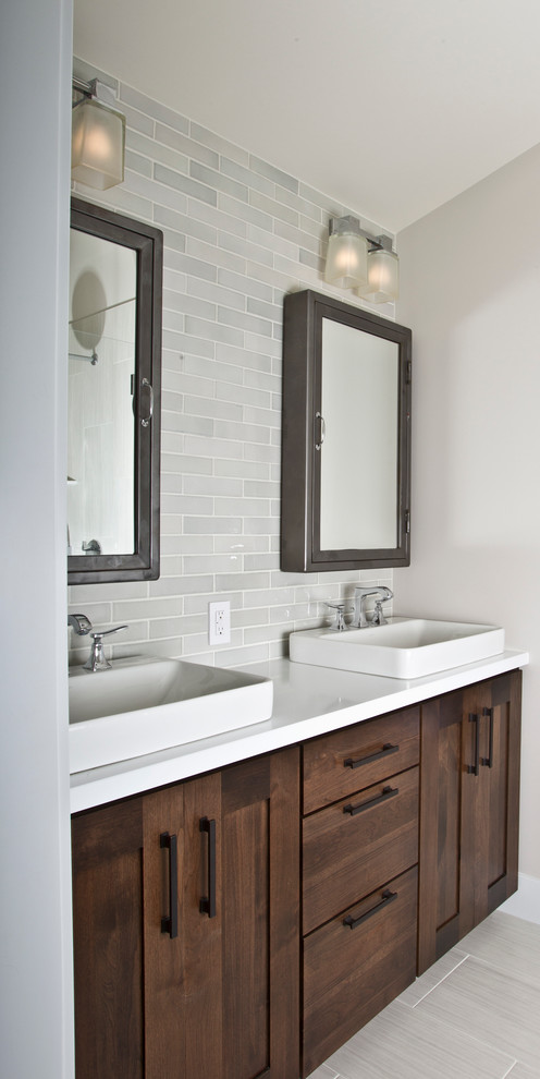 This is an example of a mid-sized transitional master bathroom in San Francisco with shaker cabinets, medium wood cabinets, engineered quartz benchtops, gray tile, ceramic tile, grey walls and porcelain floors.