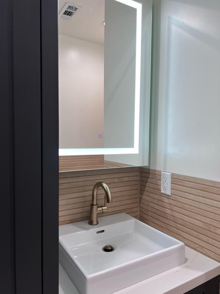 This is an example of a large cloakroom in Los Angeles with shaker cabinets, black cabinets, a one-piece toilet, brown tiles, wood-effect tiles, white walls, ceramic flooring, a built-in sink, quartz worktops, grey floors, white worktops and a freestanding vanity unit.