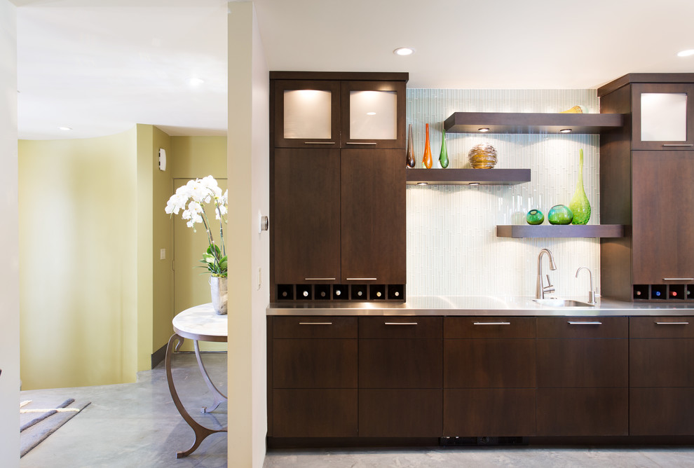Inspiration for a mid-sized midcentury galley eat-in kitchen in Salt Lake City with an undermount sink, flat-panel cabinets, brown cabinets, quartzite benchtops, stainless steel appliances, concrete floors, multiple islands, grey floor and black benchtop.