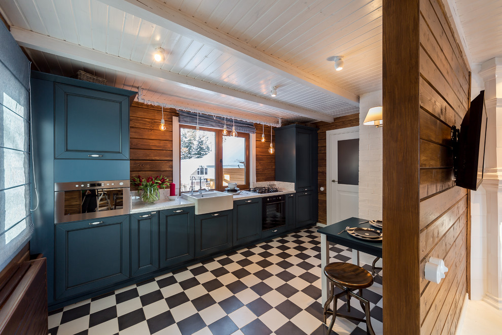 Contemporary single-wall separate kitchen in Moscow with a farmhouse sink, recessed-panel cabinets, blue cabinets, stainless steel appliances and window splashback.