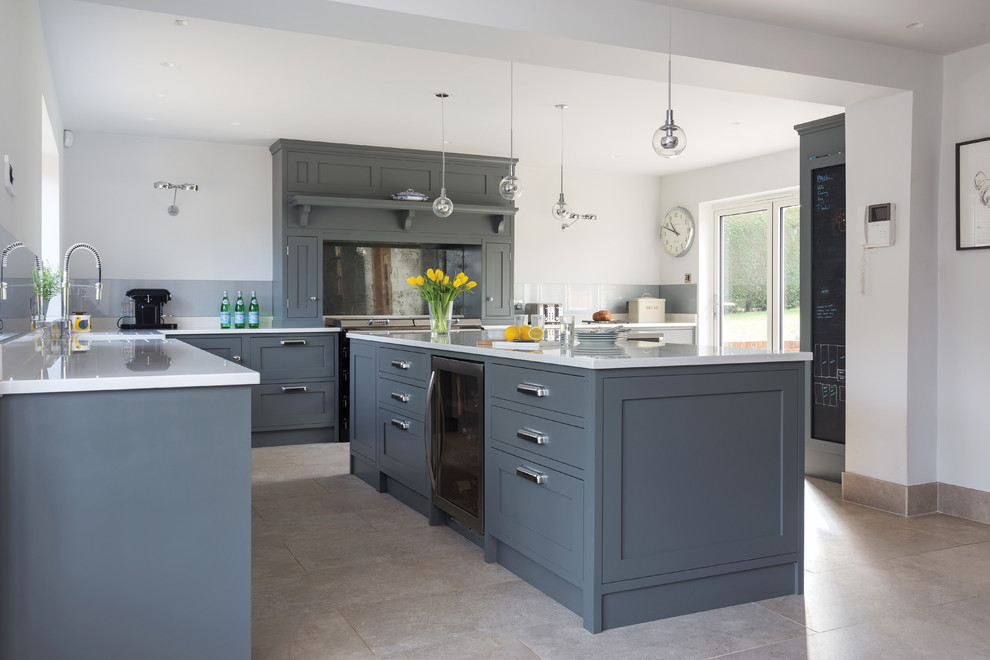 Large contemporary eat-in kitchen in Kent with a farmhouse sink, shaker cabinets, grey cabinets, quartzite benchtops, metallic splashback, mirror splashback, stainless steel appliances, porcelain floors and with island.