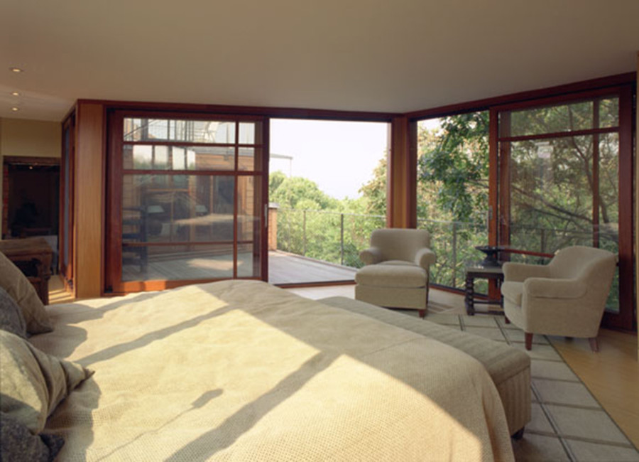 Design ideas for a mid-sized eclectic master bedroom in Boston with bamboo floors.