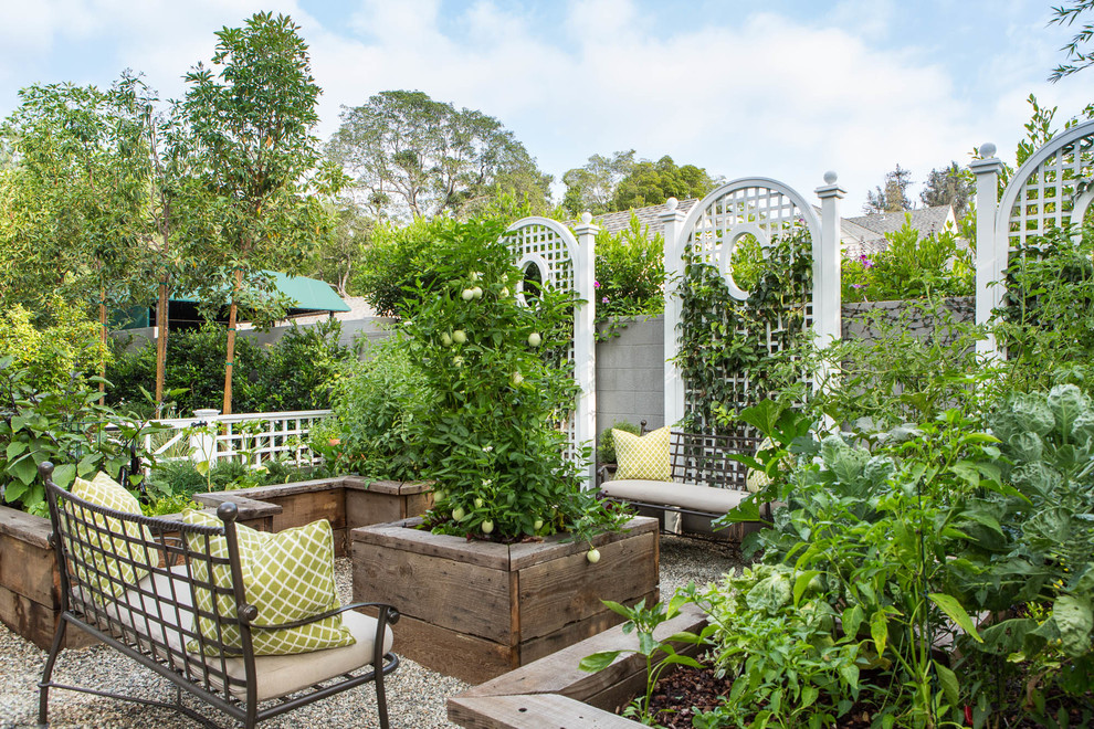 This is an example of a traditional full sun garden in Los Angeles with a vegetable garden and gravel.