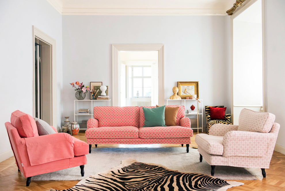 Scandinavian formal living room in Other with grey walls and medium hardwood floors.