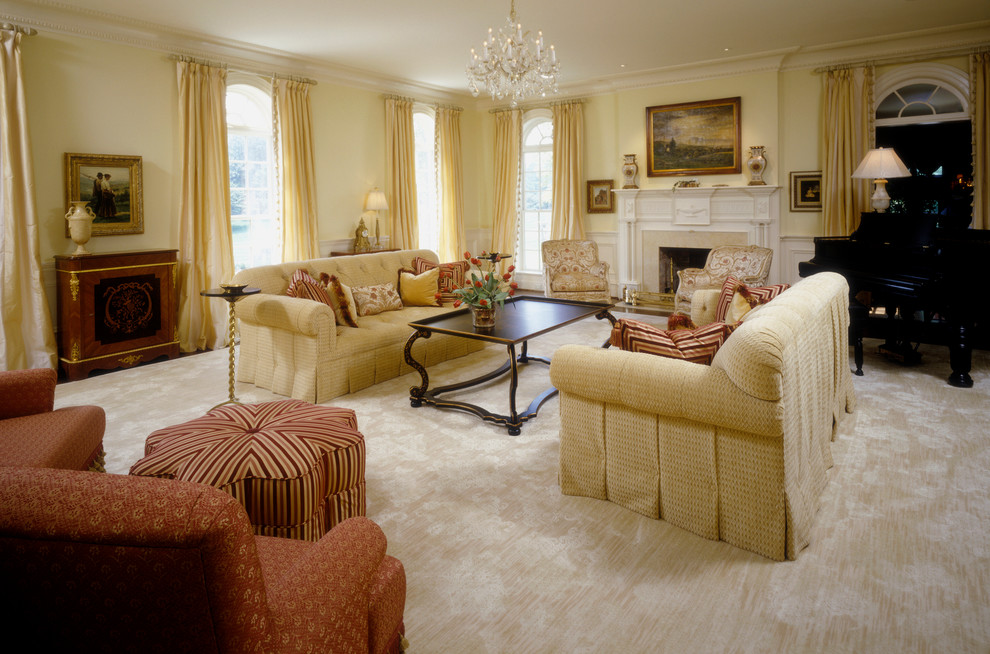 This is an example of an expansive traditional formal enclosed living room in DC Metro with yellow walls, medium hardwood floors, a standard fireplace, a tile fireplace surround and no tv.