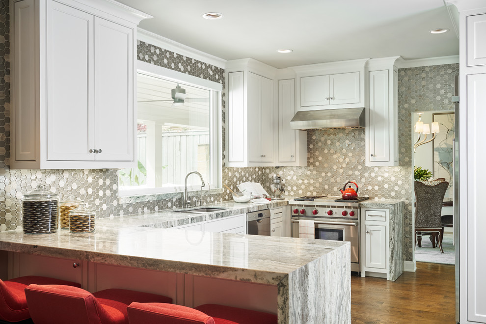 Large transitional u-shaped medium tone wood floor and brown floor eat-in kitchen photo in Dallas with an undermount sink, recessed-panel cabinets, white cabinets, marble countertops, multicolored backsplash, glass tile backsplash, stainless steel appliances and no island