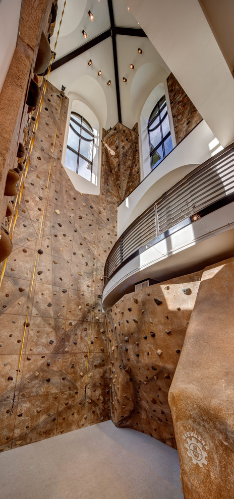 Inspiration for an expansive transitional home climbing wall in Salt Lake City with beige walls and carpet.