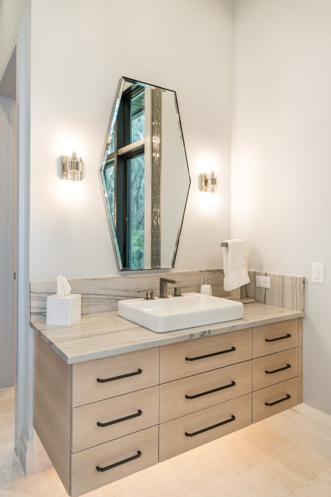Example of a large transitional master double-sink bathroom design in Orlando with flat-panel cabinets, light wood cabinets and a floating vanity