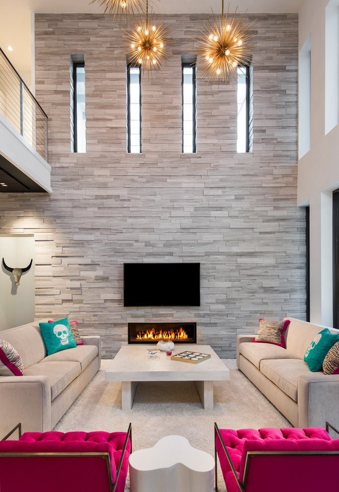 Large contemporary open concept family room in Miami with white walls, carpet, a ribbon fireplace, a stone fireplace surround and a wall-mounted tv.