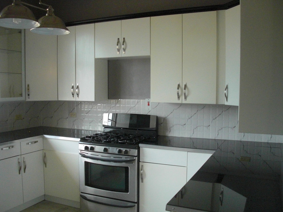 Mid-sized trendy u-shaped concrete floor kitchen pantry photo with a double-bowl sink, flat-panel cabinets, white cabinets, white backsplash, ceramic backsplash, stainless steel appliances and no island