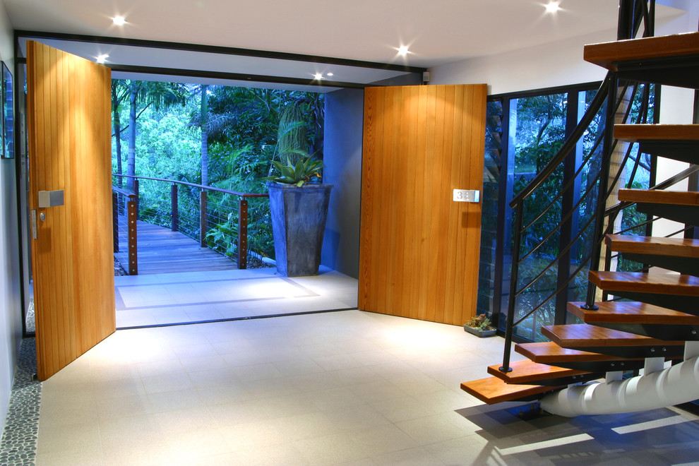 This is an example of a contemporary entryway in Brisbane with a double front door.