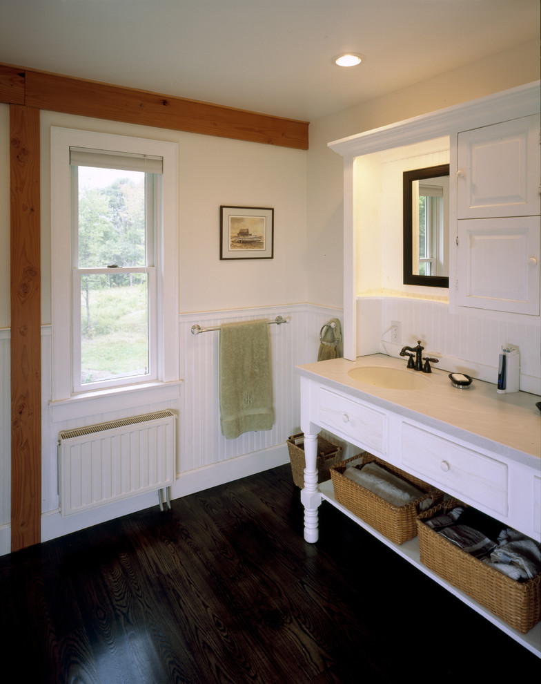 This is an example of a country bathroom in Boston with an integrated sink.