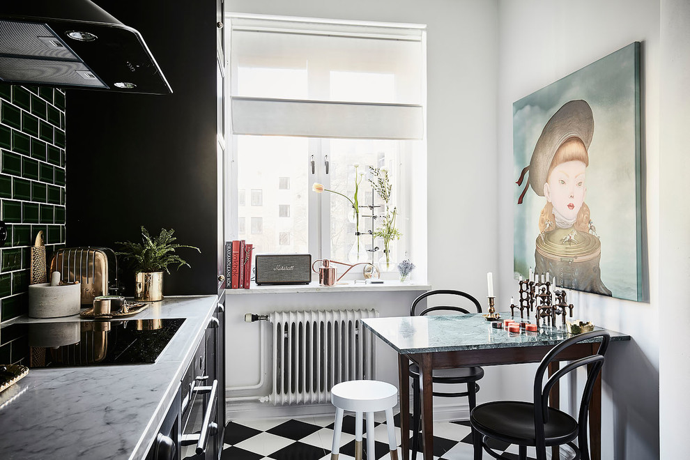 Inspiration for a small eclectic single-wall separate kitchen in Gothenburg with black cabinets, marble benchtops, green splashback, stainless steel appliances, no island and multi-coloured floor.