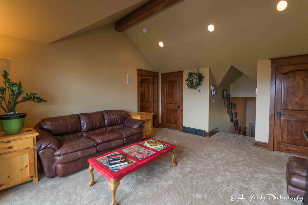 Mid-sized country loft-style family room in Other with beige walls, carpet, no fireplace and no tv.