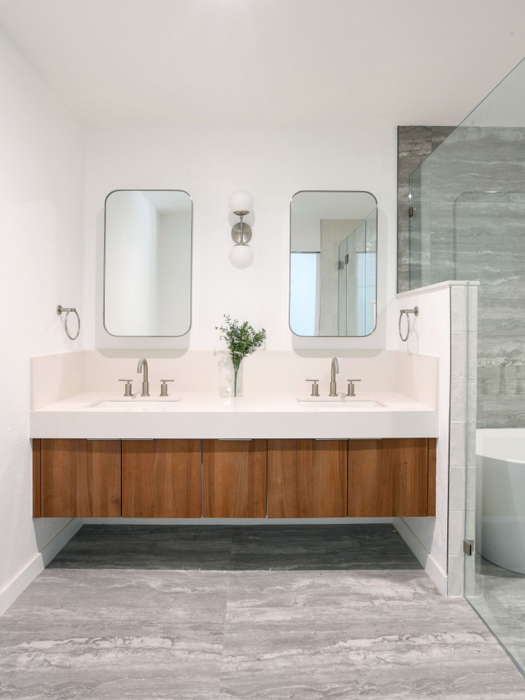 Bathroom - mid-sized modern multicolored tile and porcelain tile porcelain tile, gray floor and double-sink bathroom idea in Austin with flat-panel cabinets, medium tone wood cabinets, an undermount sink, quartz countertops, a hinged shower door, white countertops and a floating vanity