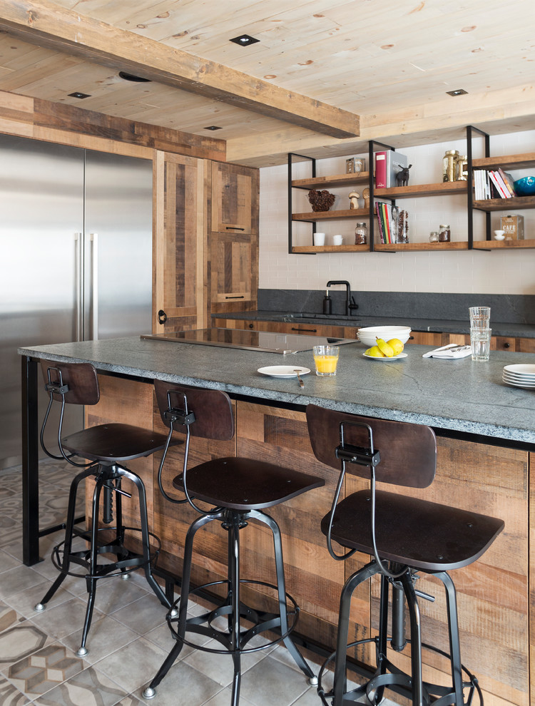 Inspiration for a country l-shaped kitchen in Montreal with flat-panel cabinets, stainless steel appliances and with island.