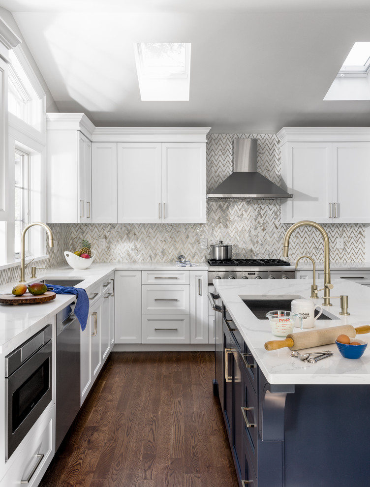 Design ideas for a mid-sized transitional l-shaped separate kitchen in New York with shaker cabinets, white cabinets, quartzite benchtops, grey splashback, marble splashback, stainless steel appliances, with island, brown floor, white benchtop, an undermount sink and dark hardwood floors.