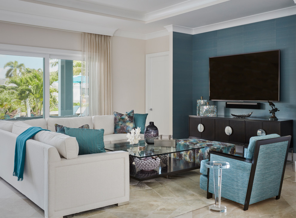 Design ideas for an expansive beach style open concept family room with white walls, travertine floors, no fireplace, a wall-mounted tv and white floor.