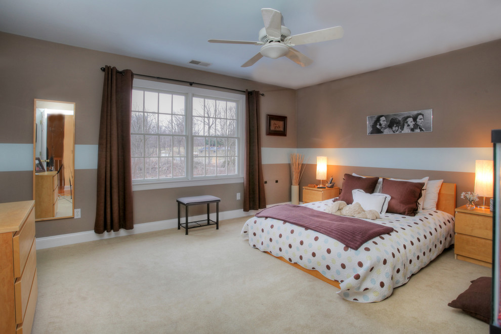 This is an example of an eclectic guest bedroom in New York with carpet, no fireplace and brown walls.