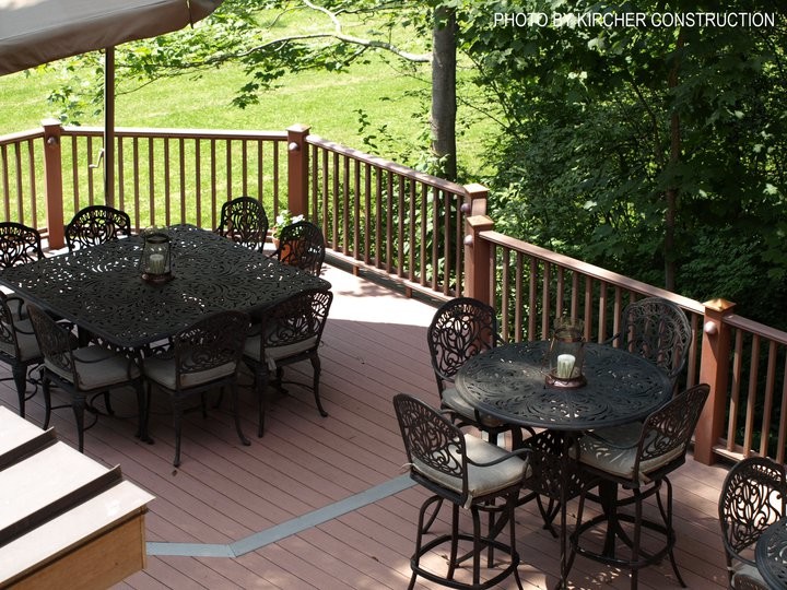 Deck - large craftsman backyard deck idea in Cincinnati with a pergola