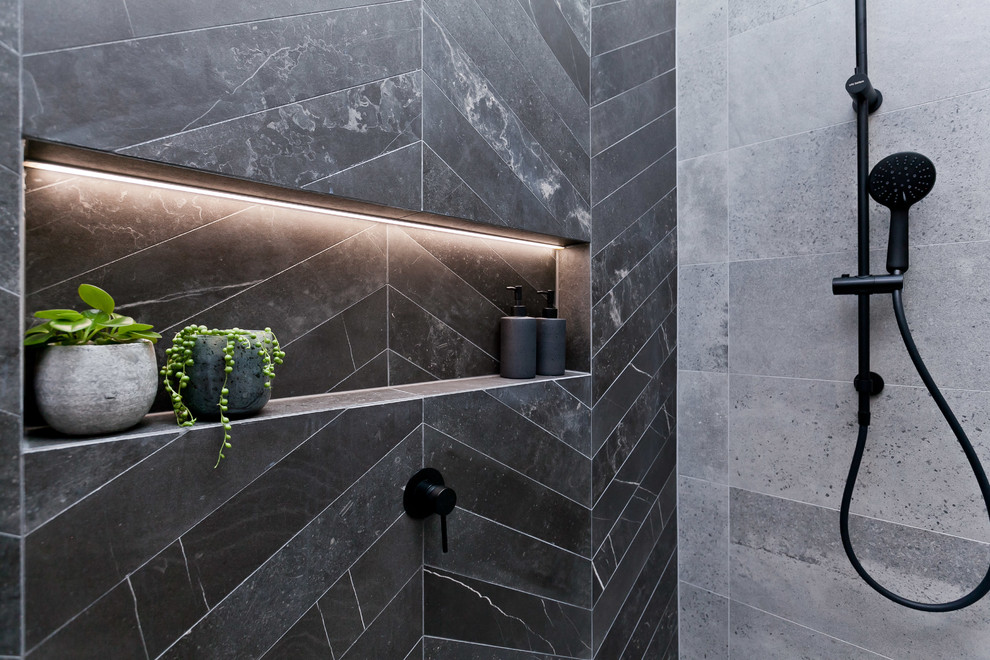 This is an example of a large modern bathroom in Perth with flat-panel cabinets, an open shower, a two-piece toilet, gray tile, porcelain tile, grey walls, porcelain floors, a vessel sink, wood benchtops, grey floor and an open shower.