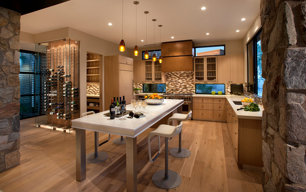Design ideas for a contemporary l-shaped kitchen in Phoenix with an undermount sink, flat-panel cabinets, medium wood cabinets, multi-coloured splashback, panelled appliances, medium hardwood floors and with island.