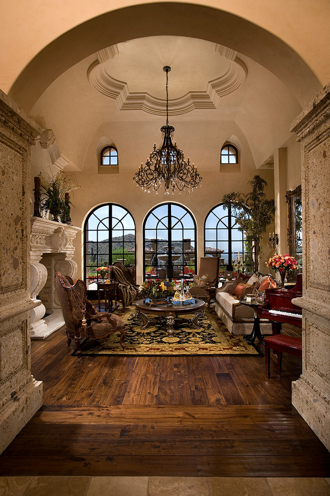 Inspiration for an expansive traditional formal open concept living room in Phoenix with beige walls, medium hardwood floors, a standard fireplace and a stone fireplace surround.