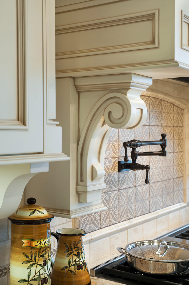 Inspiration for a mid-sized timeless u-shaped kitchen remodel in Vancouver with flat-panel cabinets and an island