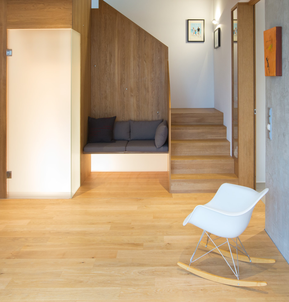 This is an example of a small contemporary wood l-shaped staircase in Stuttgart with wood risers.