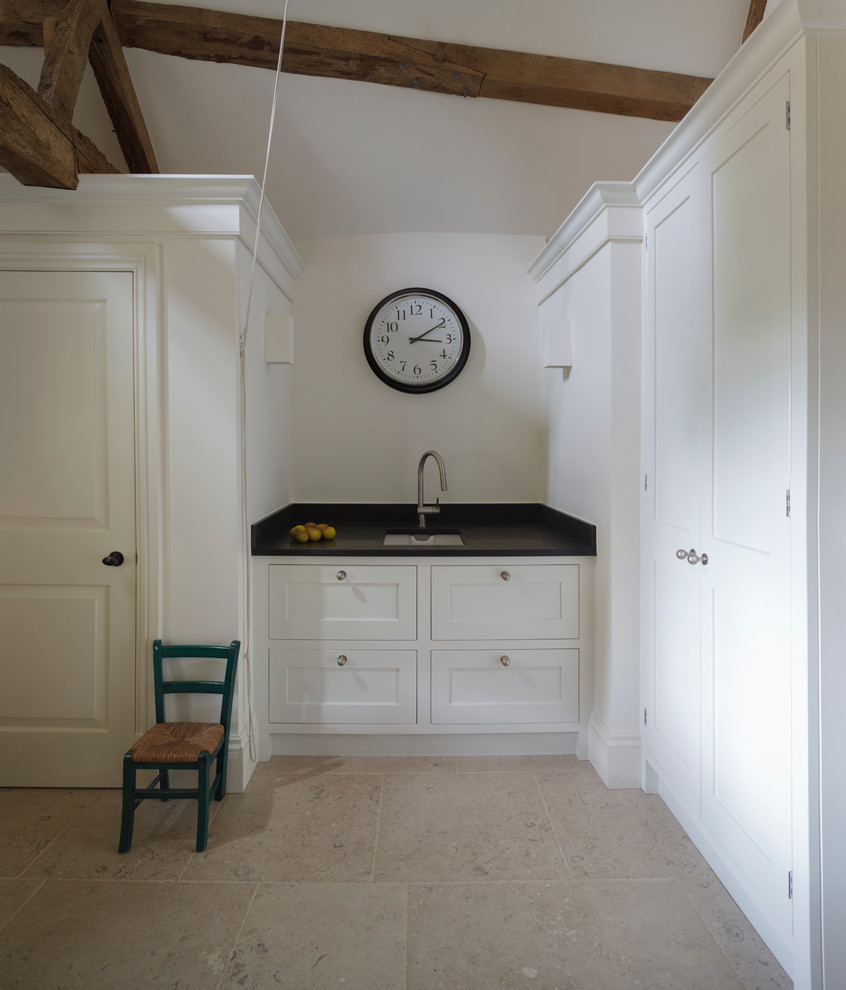 Photo of a transitional laundry room in Wiltshire.