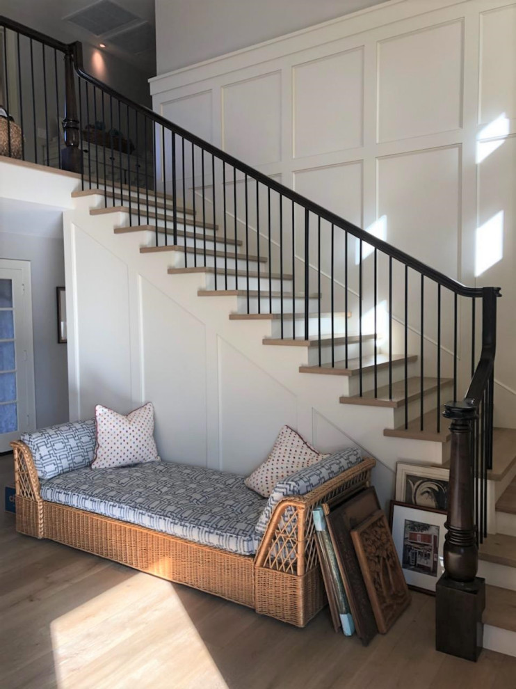 Photo of a mid-sized traditional wood l-shaped staircase in Los Angeles with wood risers and wood railing.