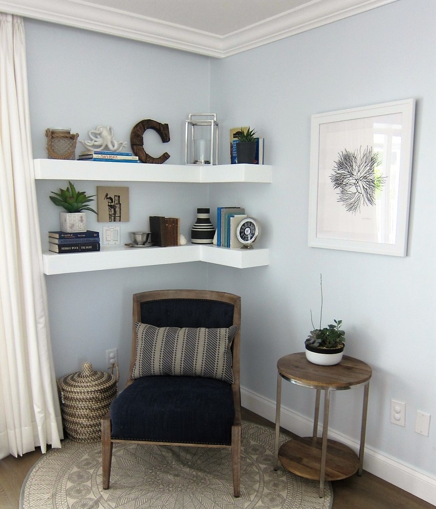 Photo of a small contemporary entryway in Miami with blue walls and vinyl floors.
