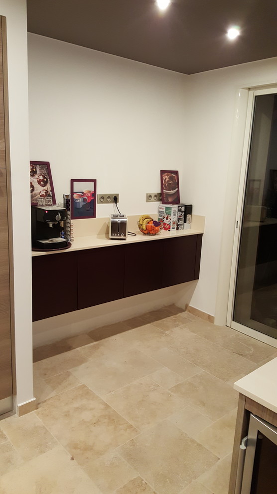 Large contemporary galley separate kitchen in Nice with flat-panel cabinets, purple cabinets, quartz benchtops, travertine floors, with island and beige floor.