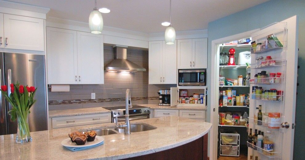 Small transitional single-wall medium tone wood floor eat-in kitchen photo in Columbus with an undermount sink, shaker cabinets, white cabinets, granite countertops, gray backsplash, ceramic backsplash, stainless steel appliances and an island